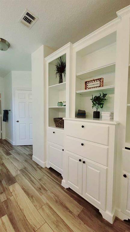 Plenty of storage & shelving in master