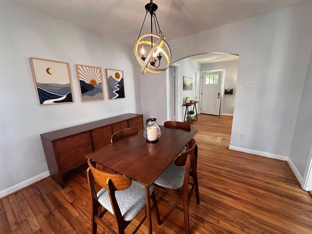 View of the Dining area with access to the kitchen and the Living Room. This home is great for those who love to entertain.