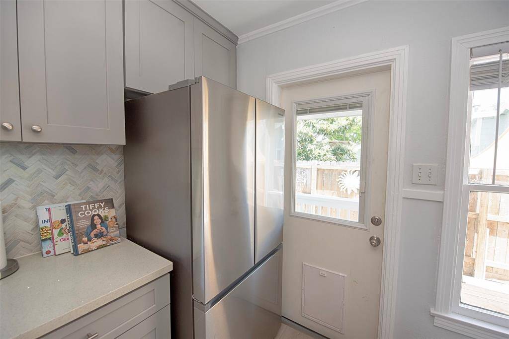 The back door opens to a covered porch area, which is a feature that the doggie door allows the 4-legged family members to enjoy too.