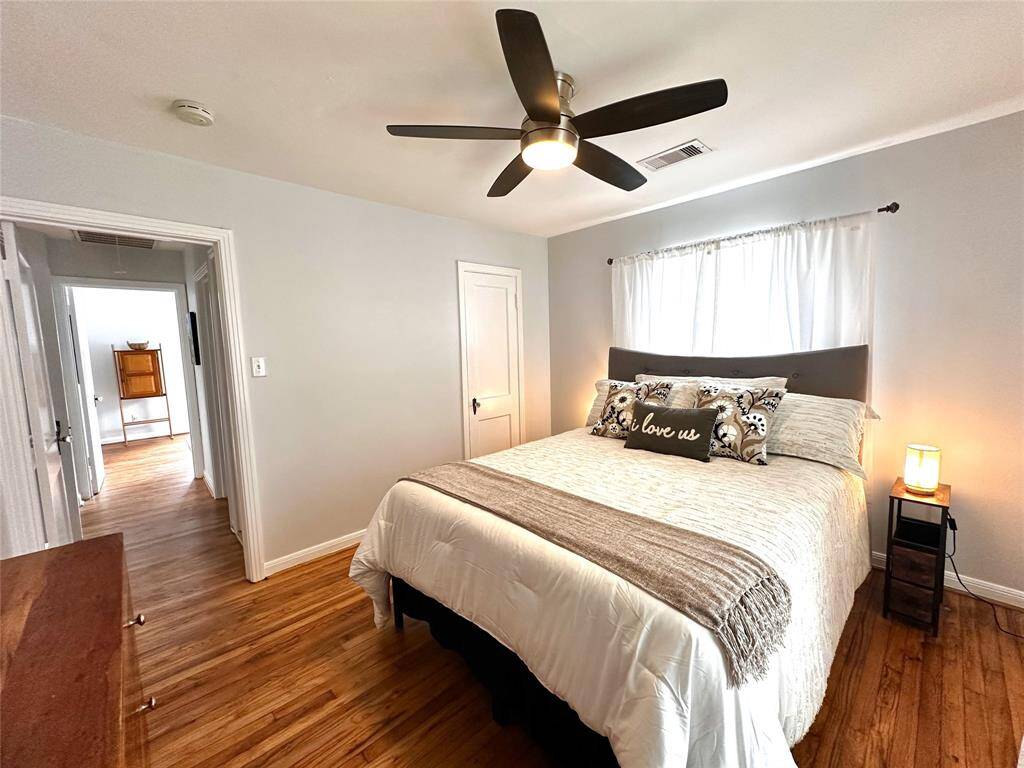 Primary bedroom closet lights automatically when door is opened. Just outside the door is a utility closet with full size washer/dryer on the right and a large linen and storage closet on the left.