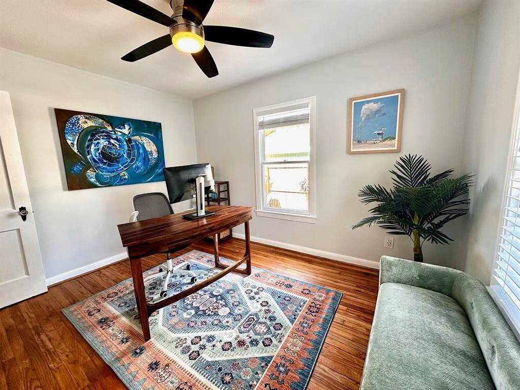 Another view of the second bedroom which also features the amazing hardwood floors and a view to the back yard.