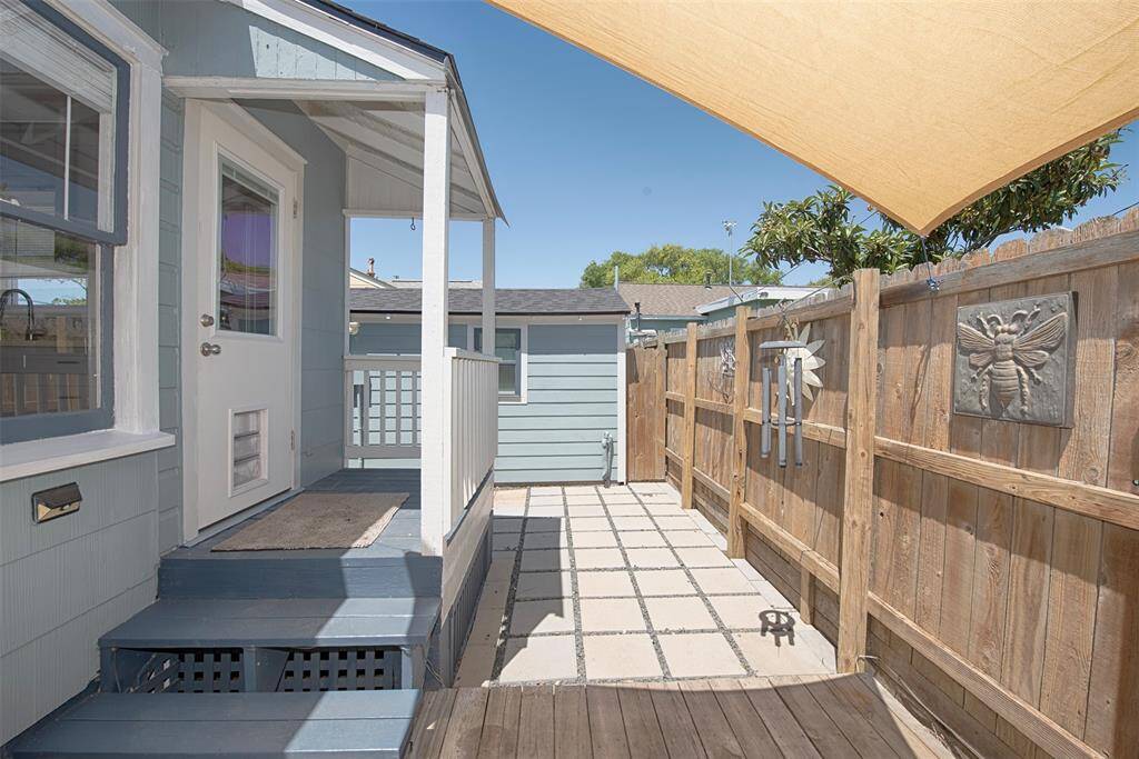 Another view of the patio and covered porch leading into the kitchen area.