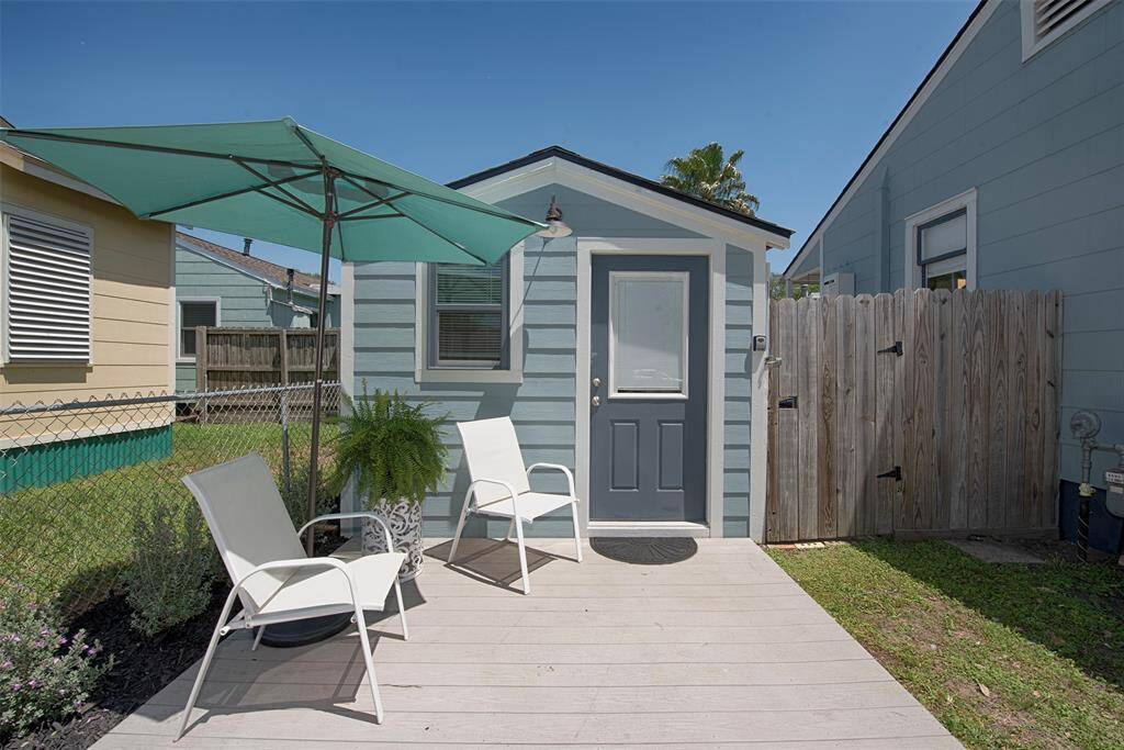 Originally a single car garage, this space was converted by the Seller into a tiny house/studio just steps away from the main home. It even has its own porch deck with a sitting area to enjoy the island breezes.