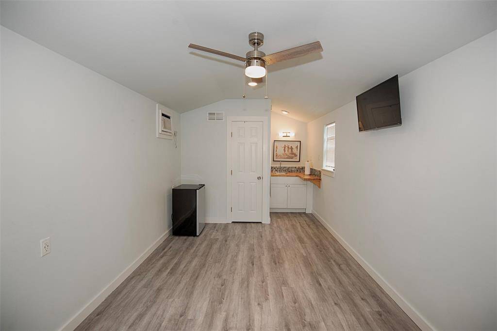 This small structure is a perfect guest house or efficiency apartment to keep or rent. This is also a nice space for a separate office, or a sofa bed for friends to share the weekend with you while providing their own privacy and separate bathroom.