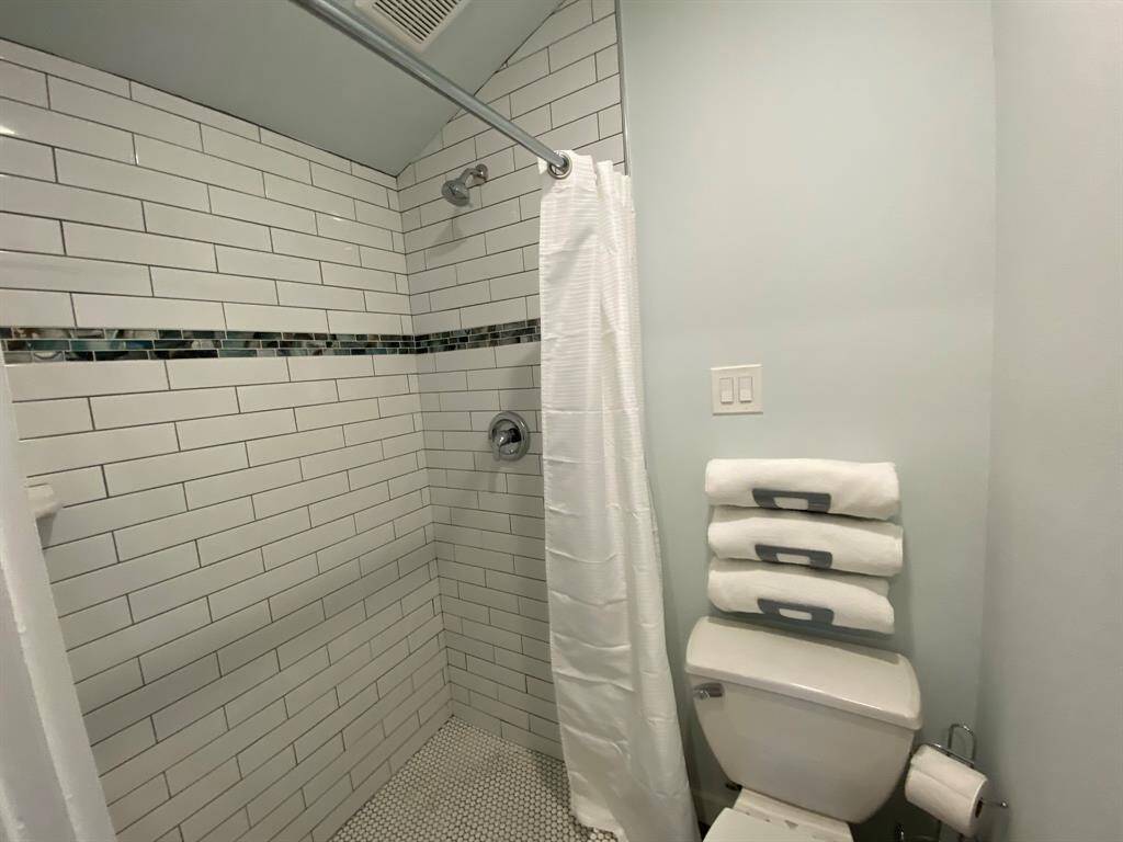 Roomy walk-in shower in the studio will make anyone feel right at home.