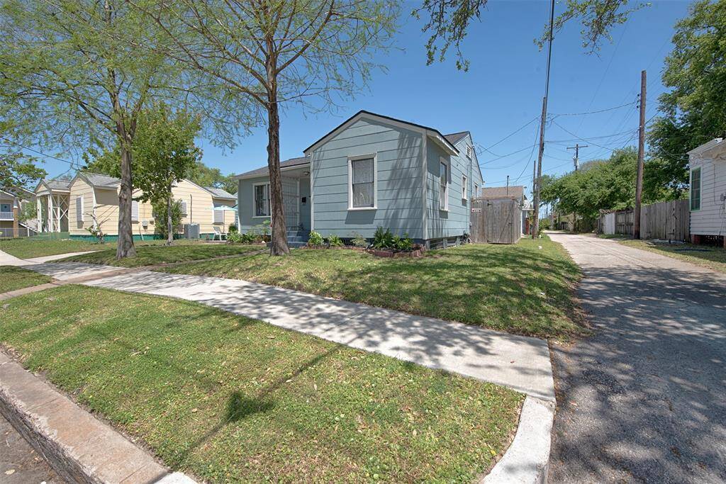Along the side of the home is an alley which will provide great additional parking when you entertain.