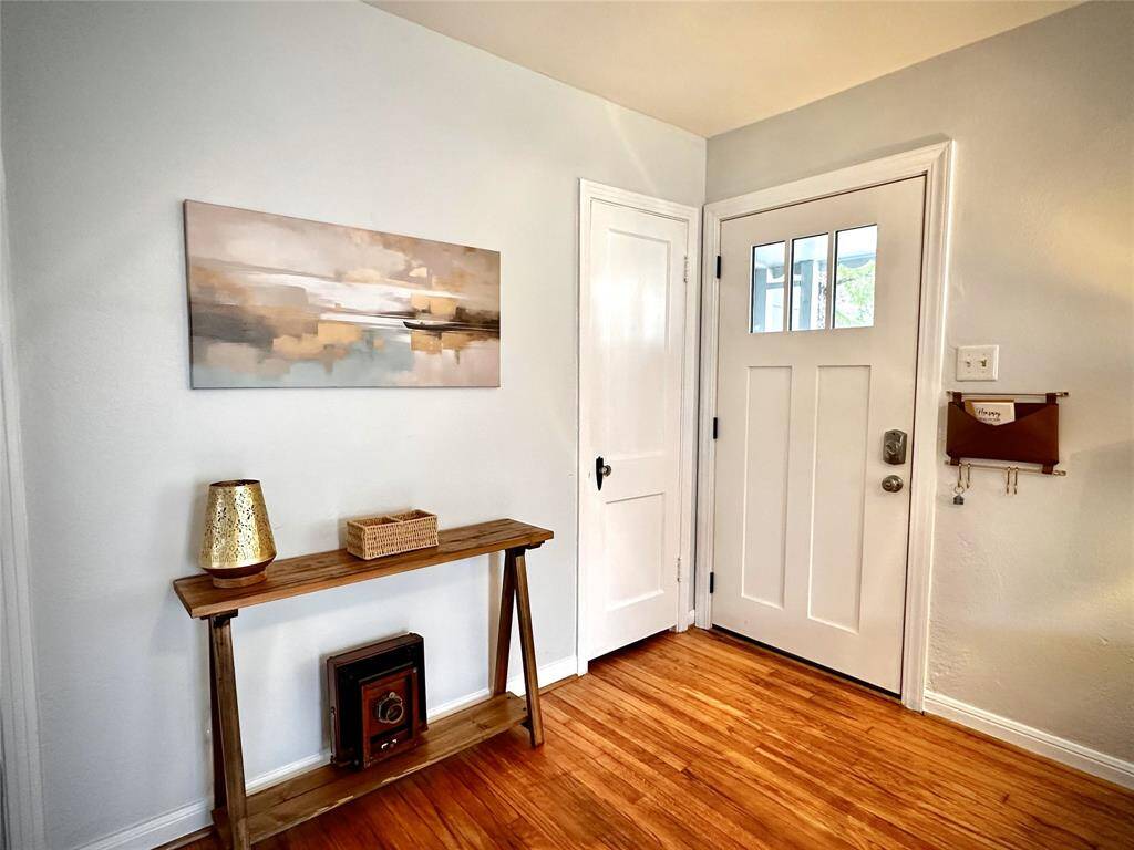 Guests will admire this welcoming entry and the newly installed front storm door. Coat closet is the door to left. USB outlets on almost every wall make modern life super easy to manage here.
