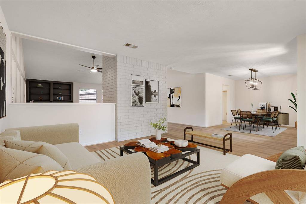 View of the formal living and dining room area. Virtually staged.