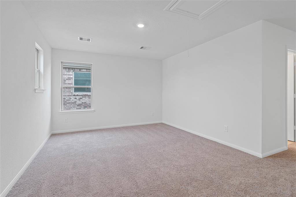 Come upstairs and enjoy a day of leisure in this fabulous loft! This is the perfect hangout spot or adult game room, this space features plush carpet, high ceiling, recessed lighting, custom paint and large windows.
