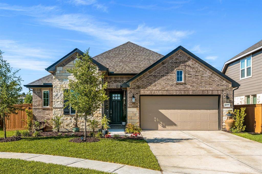 Charming home with a manicured yard, fresh landscaping and a full yard irrigation system.