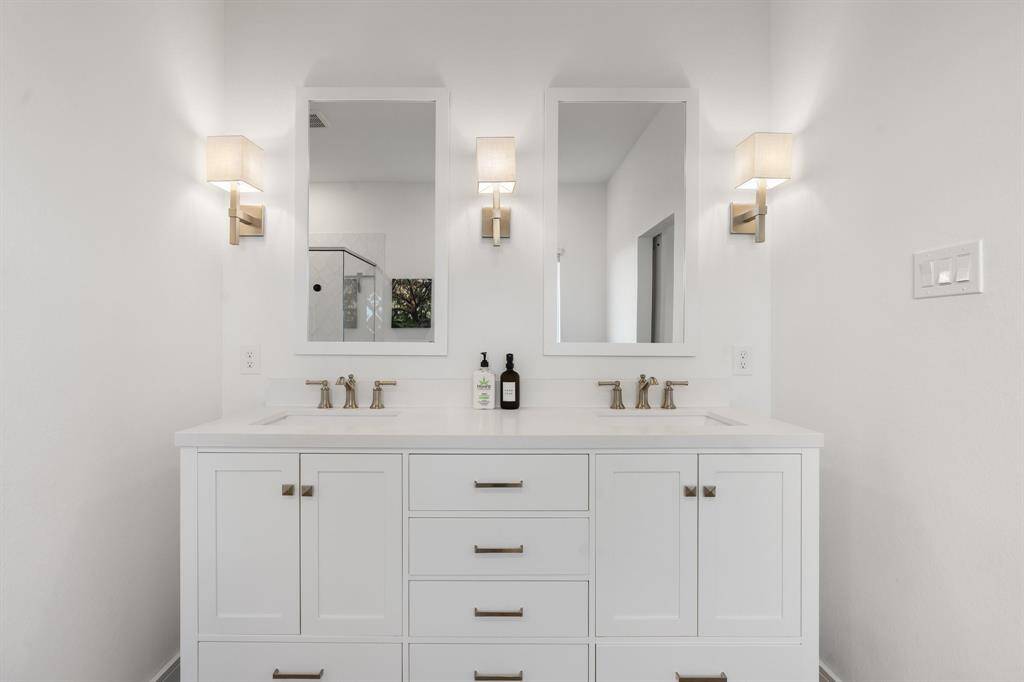 Elegant dual sinks enhance the bathroom's functionality and style.