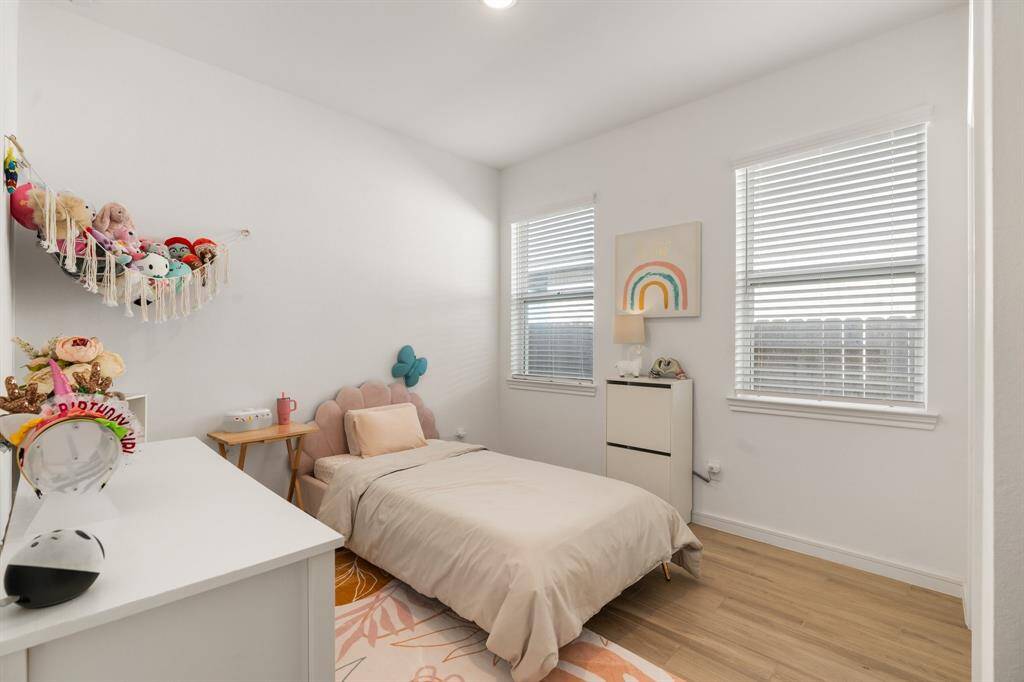 Bright and inviting secondary bedroom with ample natural light.
