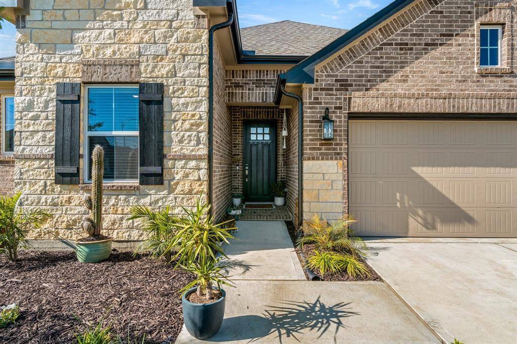 Discover your perfect retreat in this charming, beautifully crafted brick and stone home. Step inside and experience warmth and comfort.