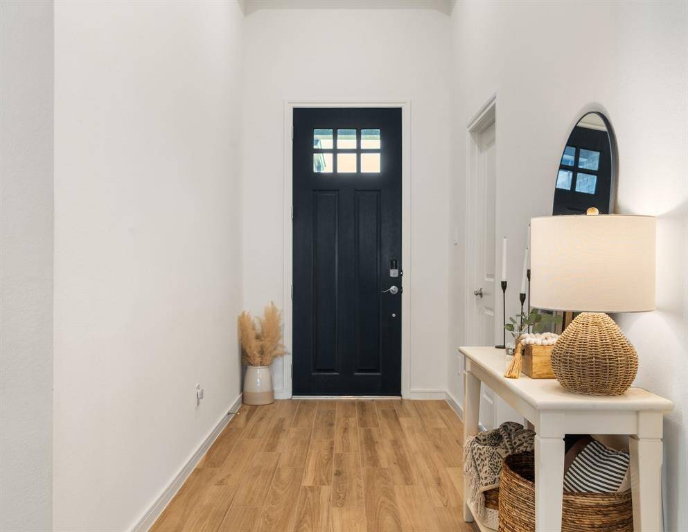 Welcoming entryway for your chic design and warm accents. You will discover the home has light wood look tile throughout the home.