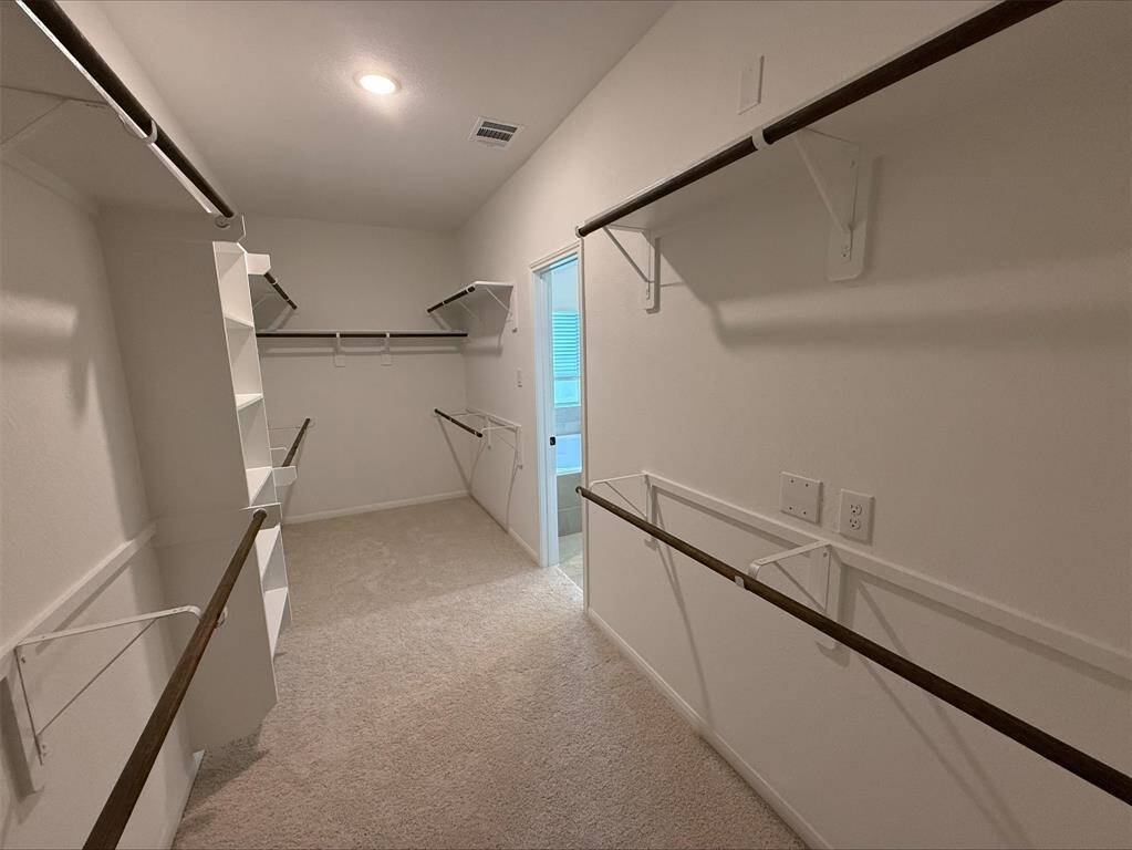 Massive walk-in closet in primary suite
