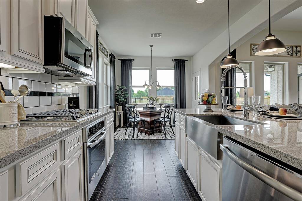 Kitchen with island (*Photo not of actual home and used for illustration purposes only.)