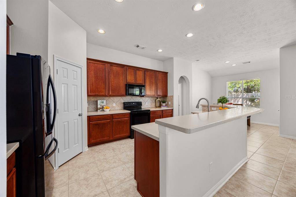 Open concept kitchen looking into the family room.
