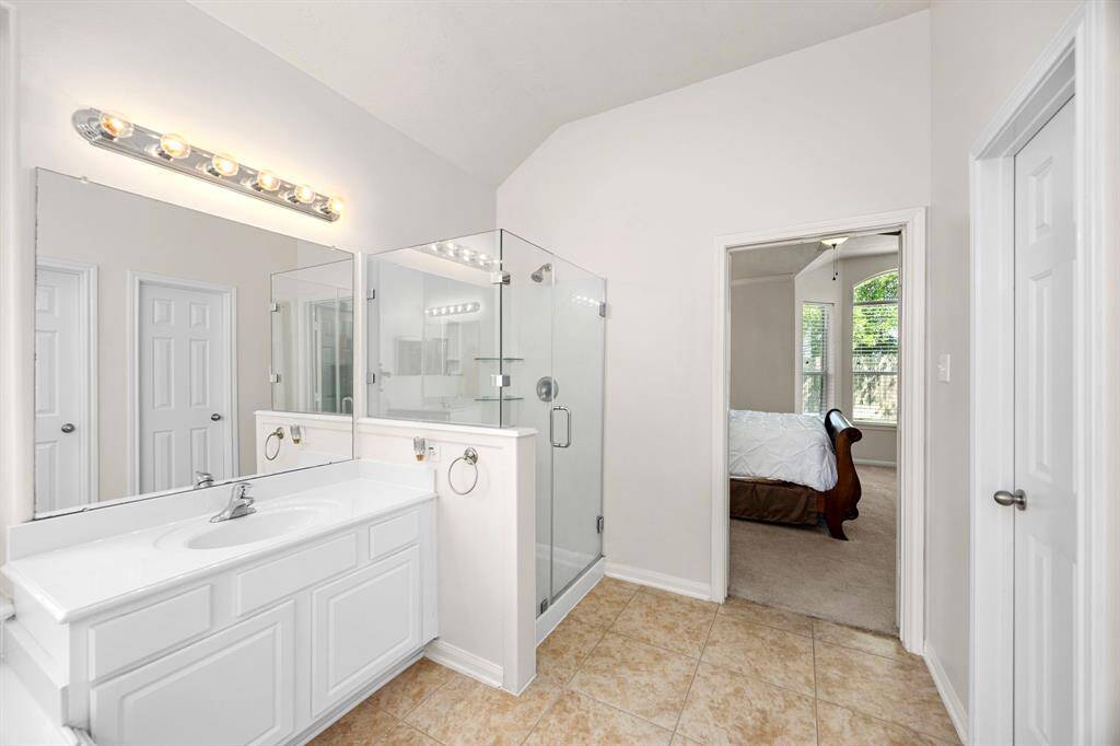 One of three of the generously sized secondary bedrooms.  This one was being used as an office and excersize space.  The seller is leaving the TV.