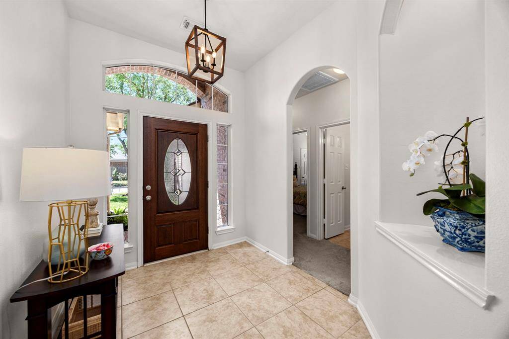 The delightful entryway welcomes you upon entering this home.