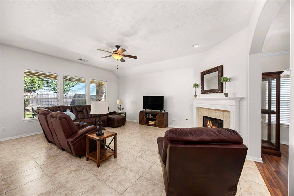 The open floor plan seamlessly connects the living and dining areas, providing a versatile space for entertaining and everyday living.