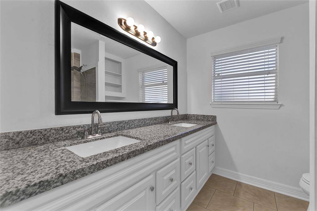 Second full bath with double vanities