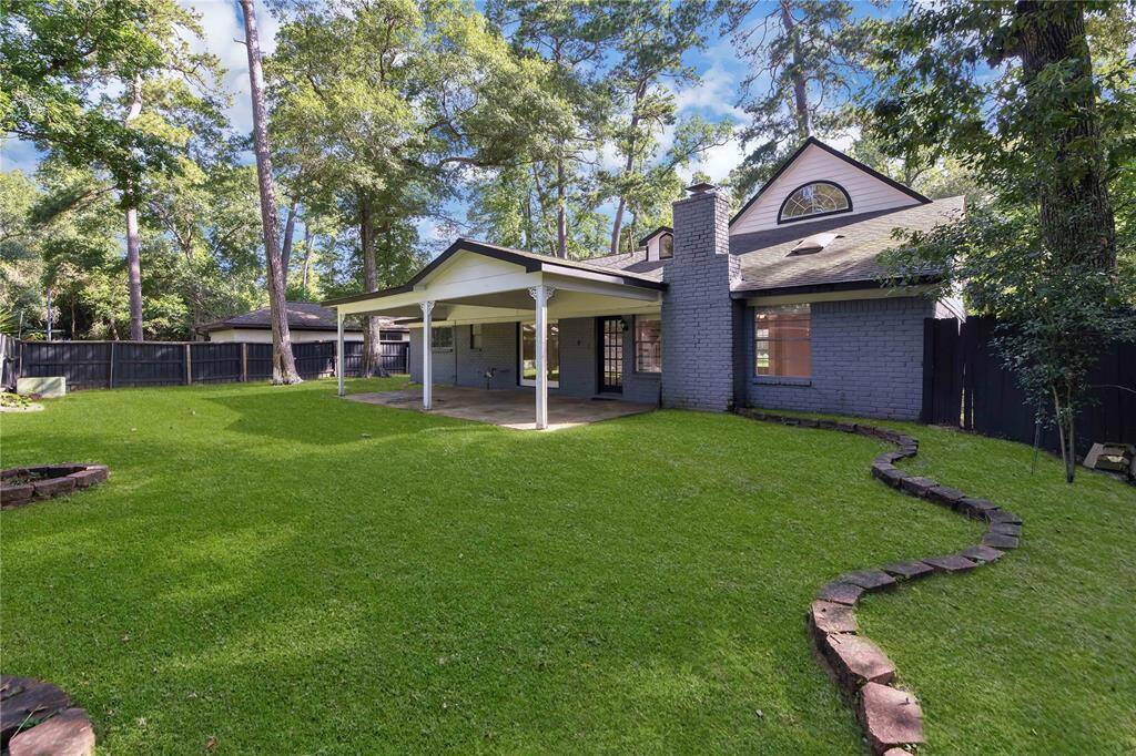 Large backyard with an expanded covered patio