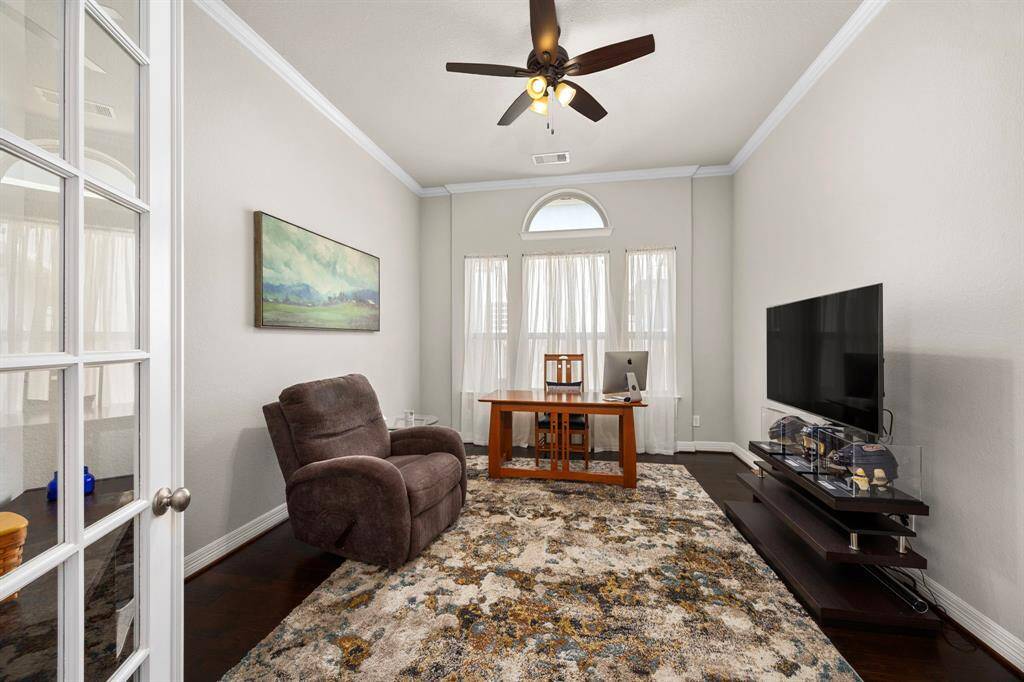 The spacious study is situated off the main entry foyer and sits behind double French doors. The room can easily accommodate large office furniture with plenty of room left over for a sitting area.