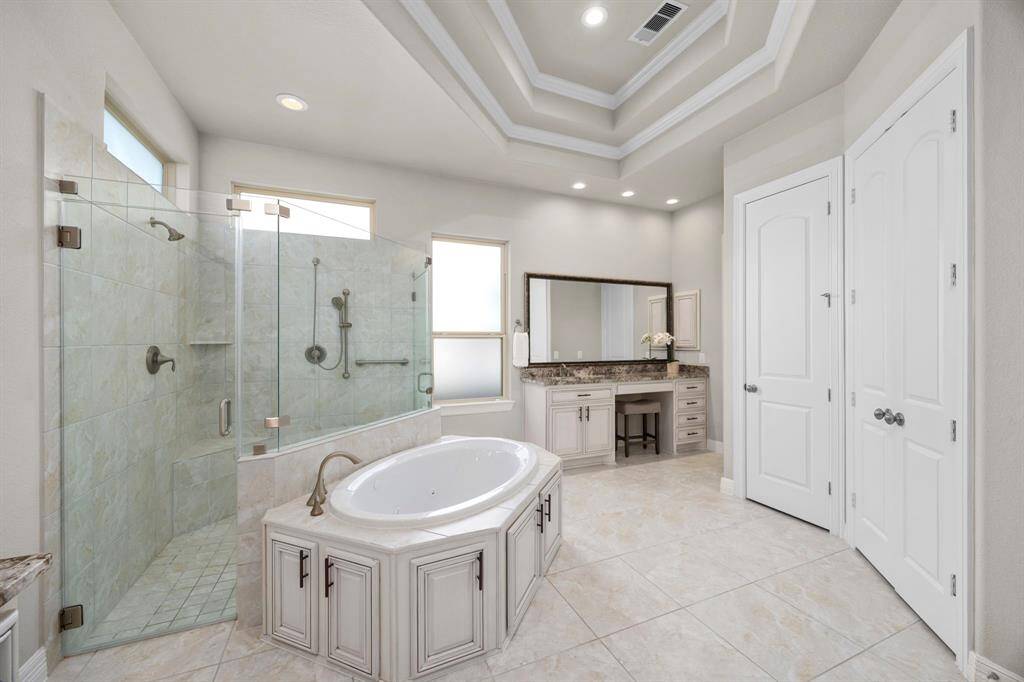 This bath is perfect with seperated double vanities, expansive mirrors and great overhead lighting. The large window fills the space with soft, natural light. Seperated "His & Hers" walk-in closets and the large linen closet are all extra perks.