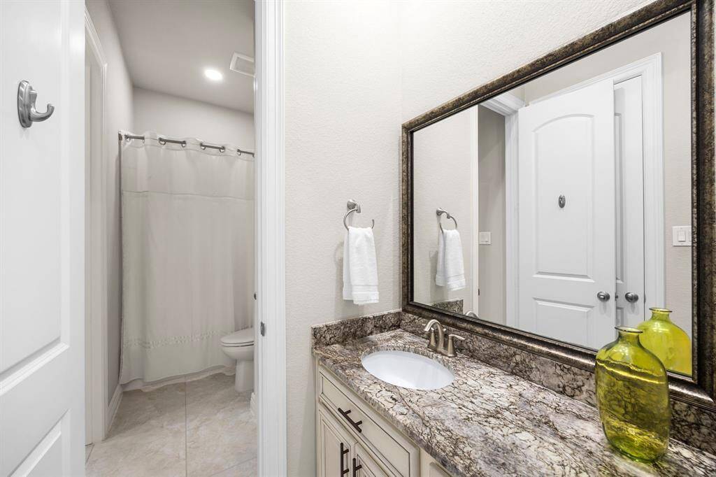 The Jack/Jill Bathroom sits between BR 2 & BR 3 down the front hallway off the main foyer.