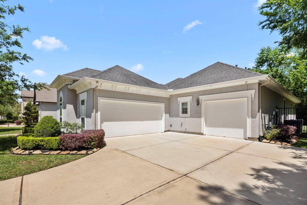 The extra-wide drive leads to the double-car and the single-car garages. There is plenty of space for off-street parking for both homeowners and guests.