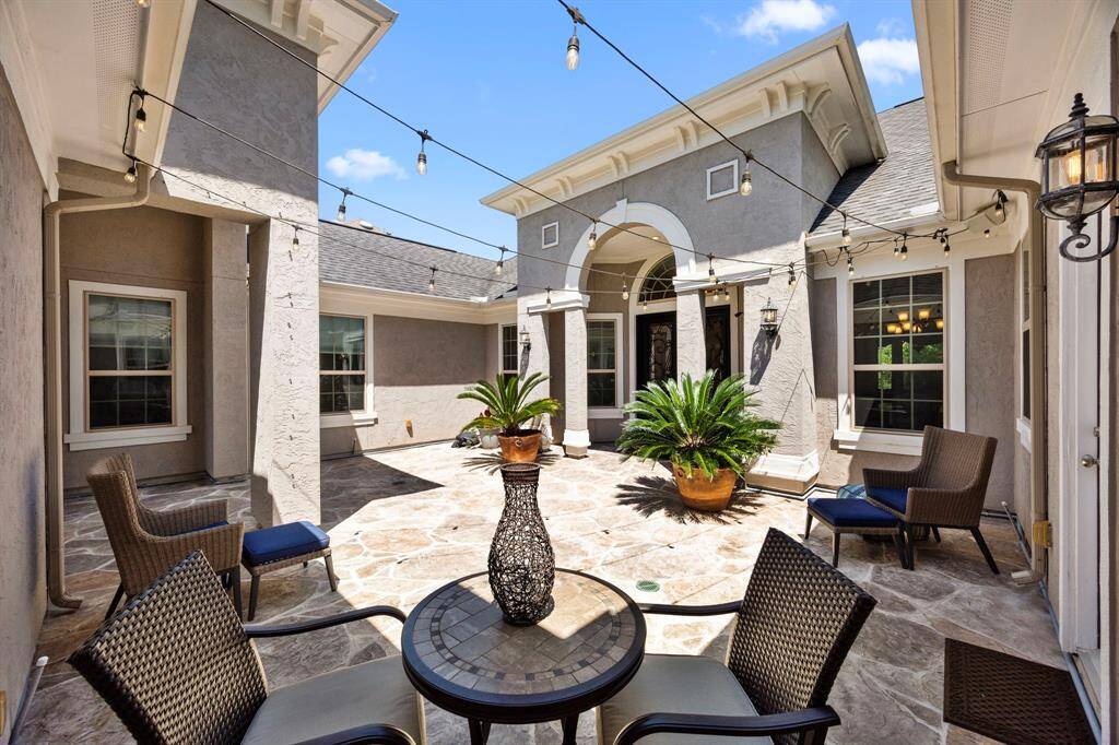 No, this isn't a courtyard at a 5-star hotel. It sits just steps outside the front door of this stunning home.  Imagine enjoying some quiet time in the sunshine or evening twilight. Perhaps invite a few friends to join you in this peaceful setting or let the kiddos use it for a safe playspace!