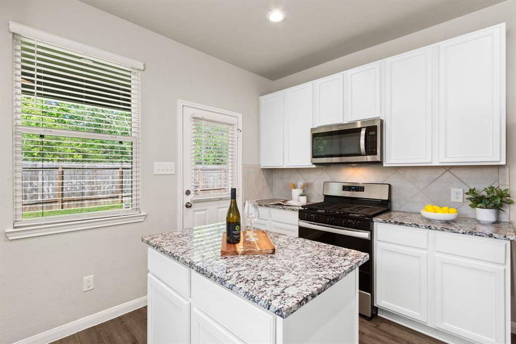 Shiny almost new cabinets and quartz countertops!