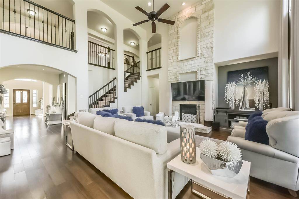 Cozy living room with a beautiful fireplace and open flow to the main living areas.