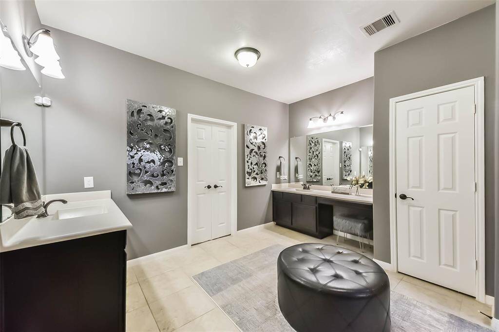 Spacious primary restroom with dual vanities