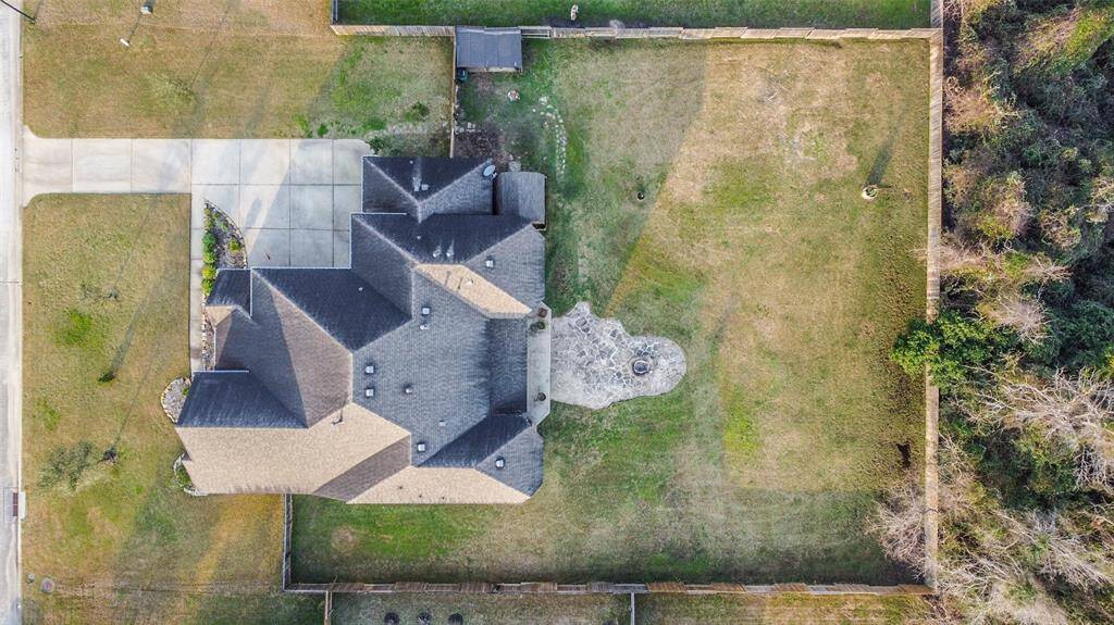 Expansive backyard seen from above—room to play, garden, or build your dream outdoor space