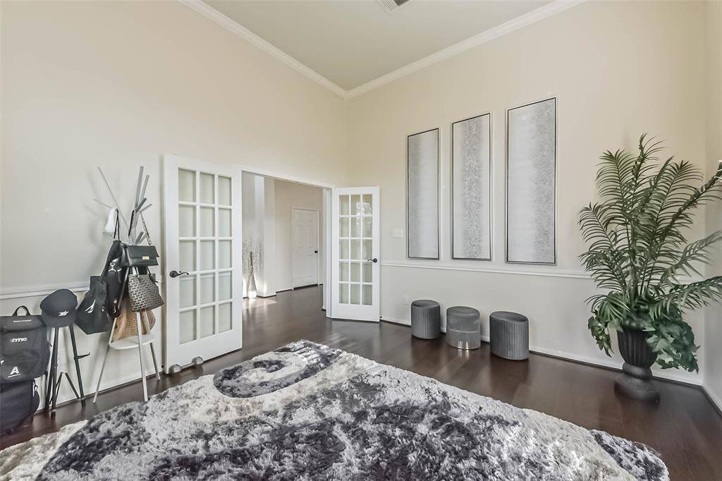 Upon entering the home, the inspiring office/flex space to your right welcomes you with its graceful French doors, inviting creativity and productivity.