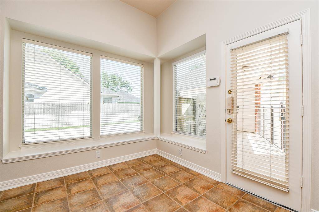 Bright and inviting breakfast nook with abundant natural light, offering a cozy spot to start your day.