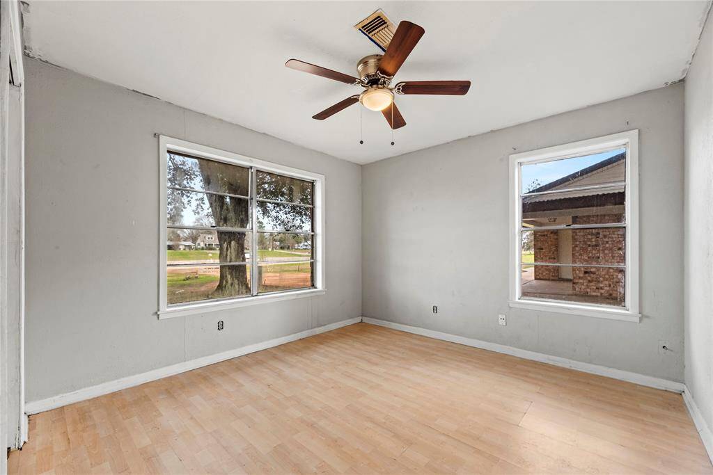 The thoughtfully designed layout of the second bedroom allows for natural light to flood the room, creating a warm and welcoming atmosphere.