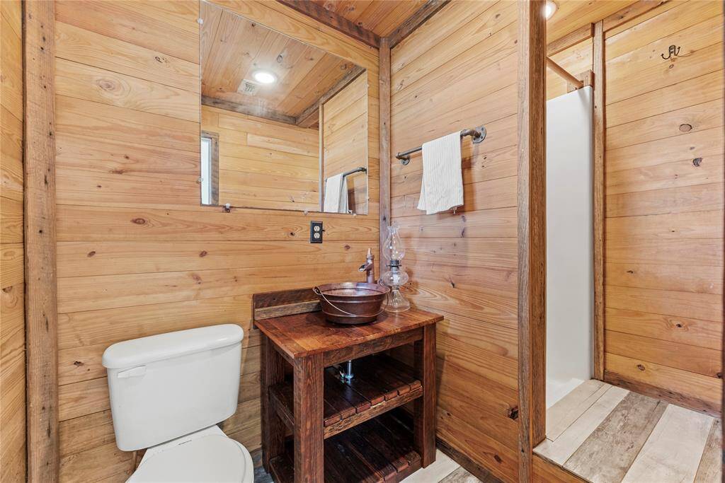 The secondary bath with separate shower.