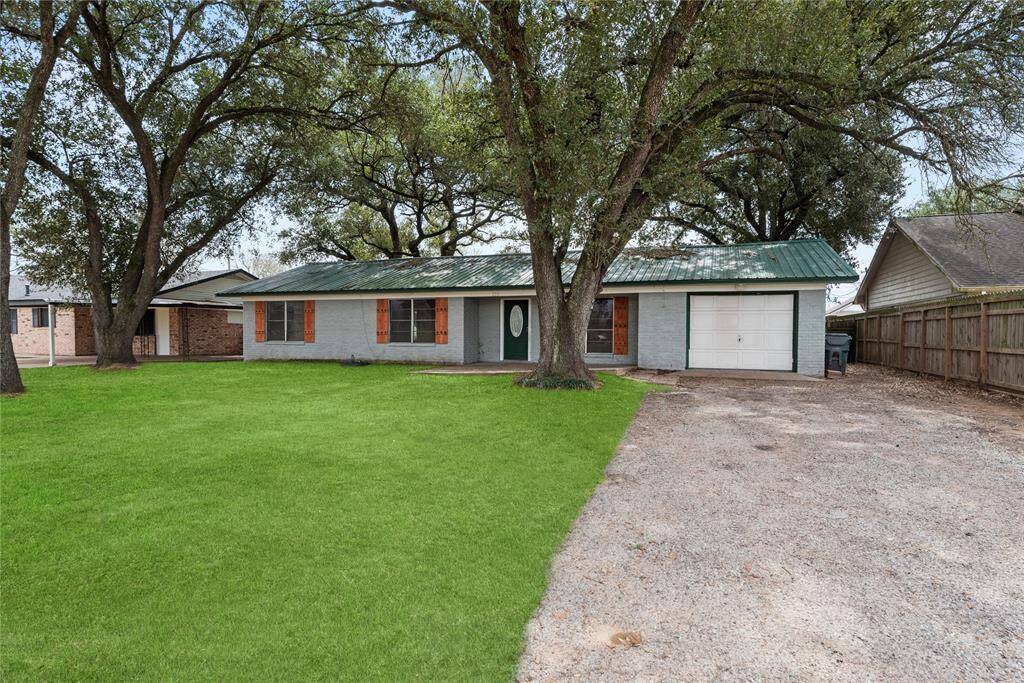 Mature trees and striking curb appeal combine to create a welcoming atmosphere.