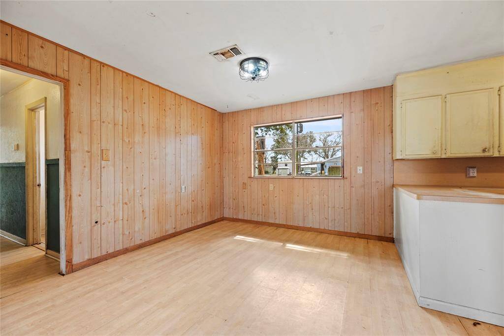 The dining area is perfect for a full-sized table and boasts easy care floors, and large bright windows.