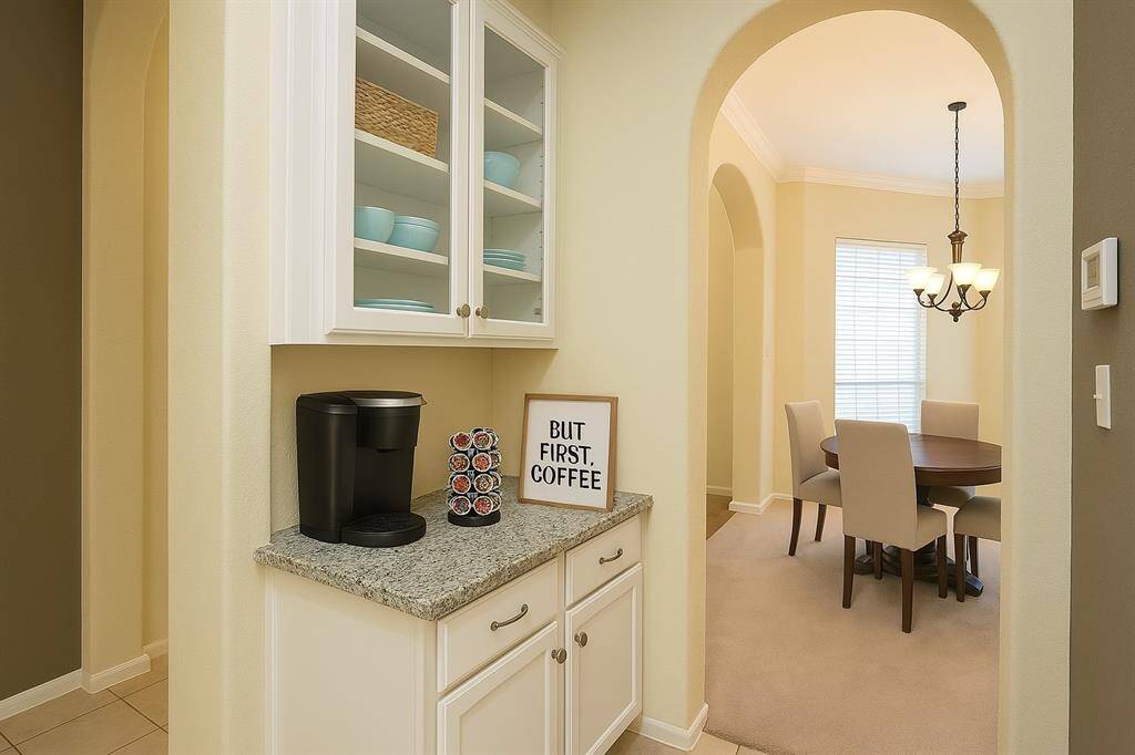A convenient butler’s pantry sits between the kitchen and formal dining room, offering extra storage and prep space perfect for entertaining or keeping your kitchen clutter-free. Virtually staged