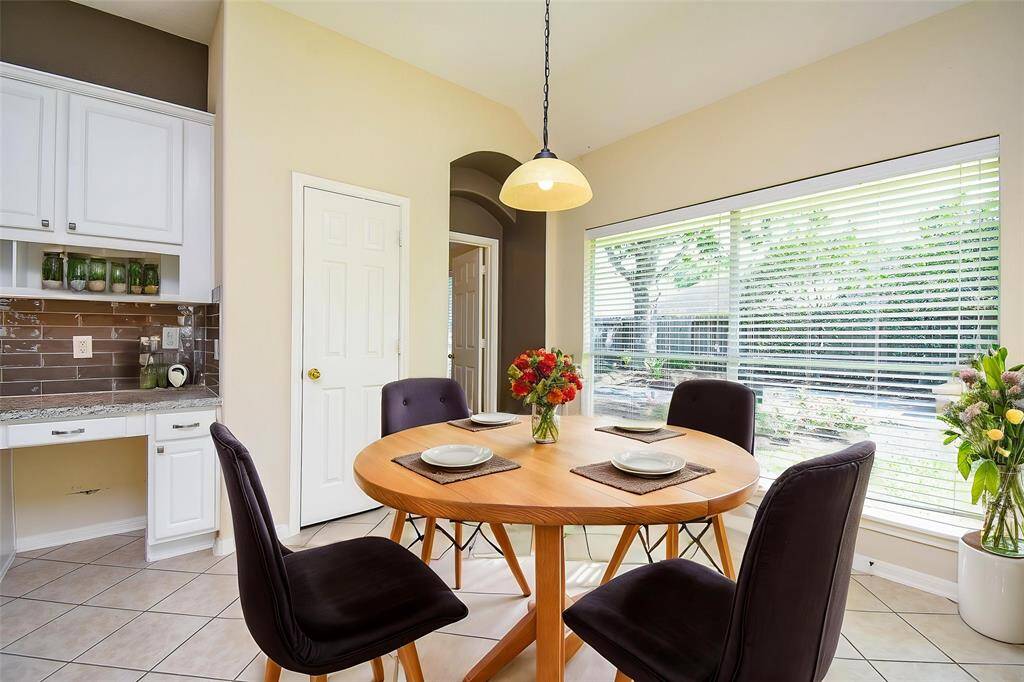 The breakfast nook sits just off the kitchen, surrounded by windows for a bright and cozy experience. Also featured is a built-in study niche perfect as a homework station, coffee bar, or extra storage, the possibilities are endless in this thoughtfully designed space. Virtually staged photo