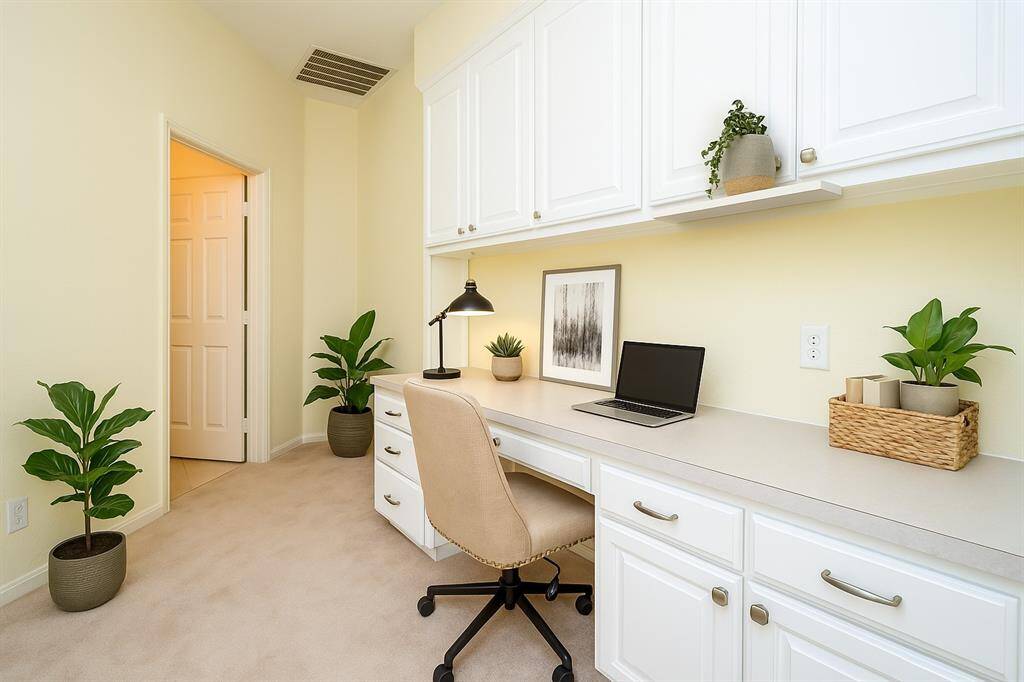 A convenient study niche is tucked between the two secondary bedrooms, offering the perfect spot for a homework station, reading corner, or compact home office. Virtually staged