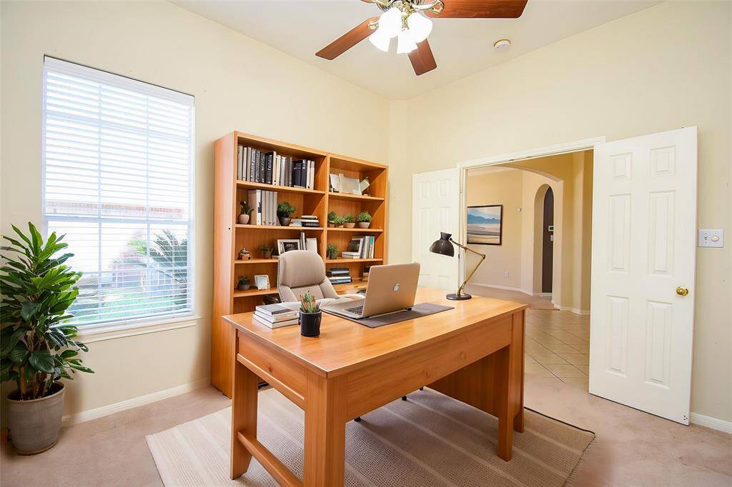 The private study features large windows, abundant natural light, and elegant French doors perfect for a home office. It can also be easily converted into a 4th bedroom to suit your needs. Virtually staged photo