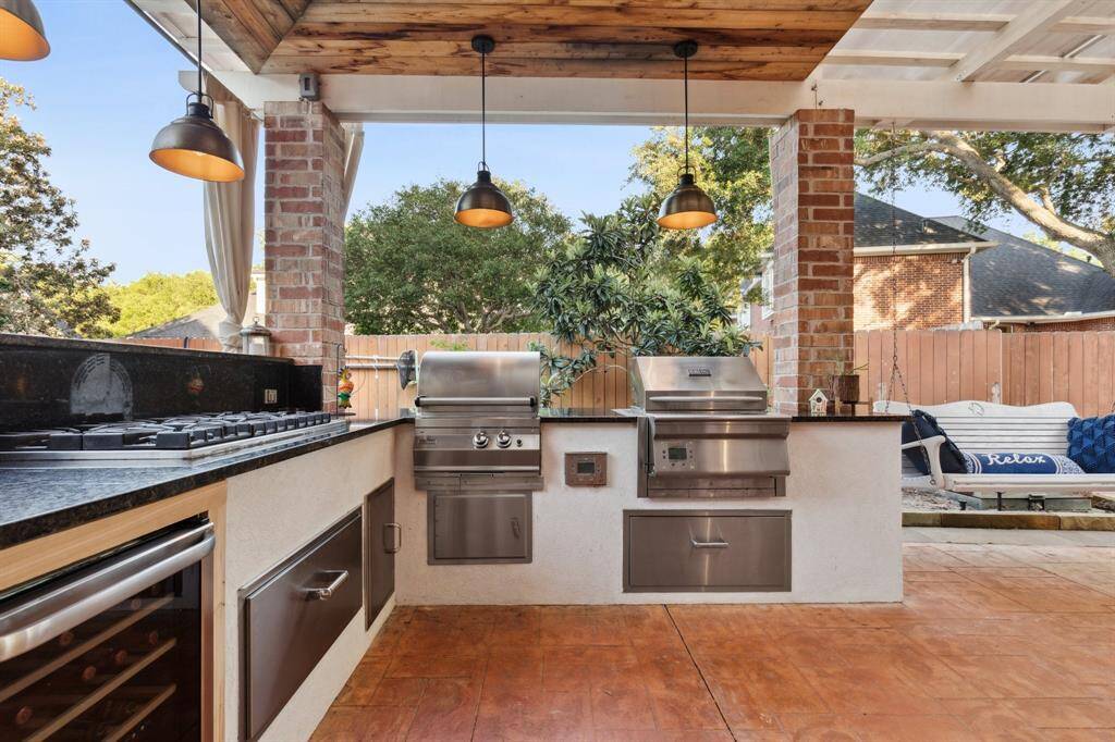 Beautiful outdoor kitchen with multiple cooktops
