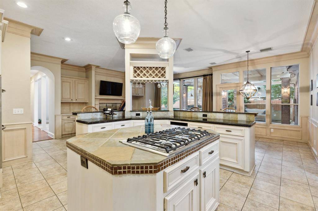 Open kitchen with bar seating and views to the breakfast area.