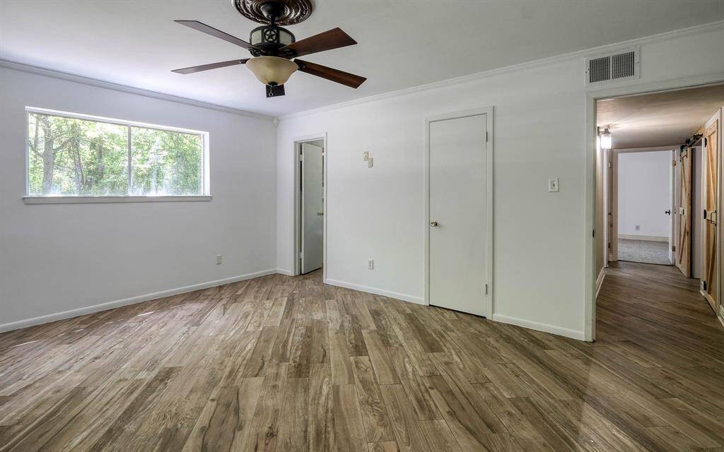 Another view of the primary bedroom on the first floor.