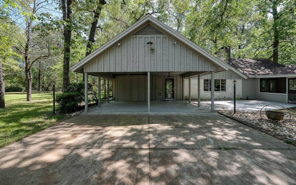 Two car covered area with a patio area to the right with entrance to the screened in area farther to the right!