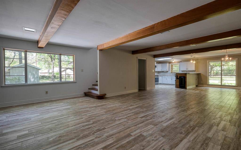 Family room view with kitchen and stairway to the second floor bedroom!